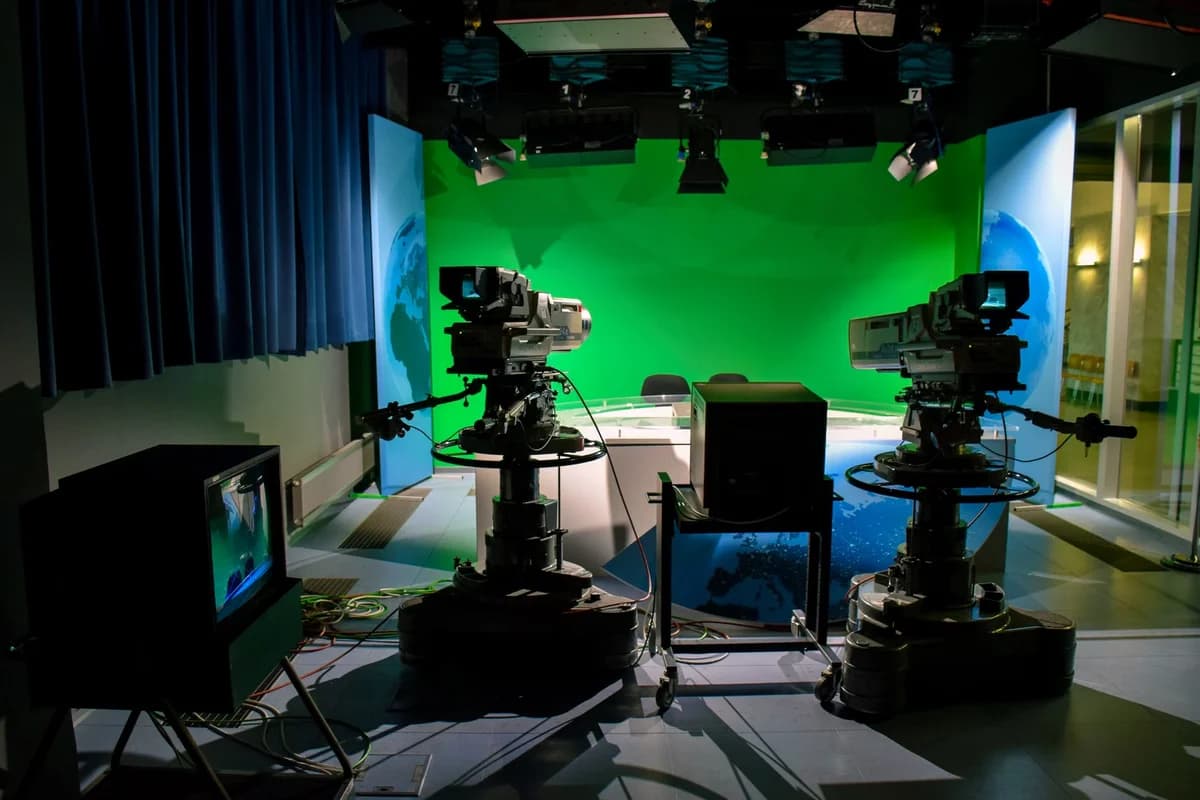 TV studio setup with two cameras and green screen
