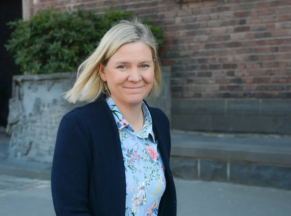 Magdalena Andersson walking outdoors in Stockholm.