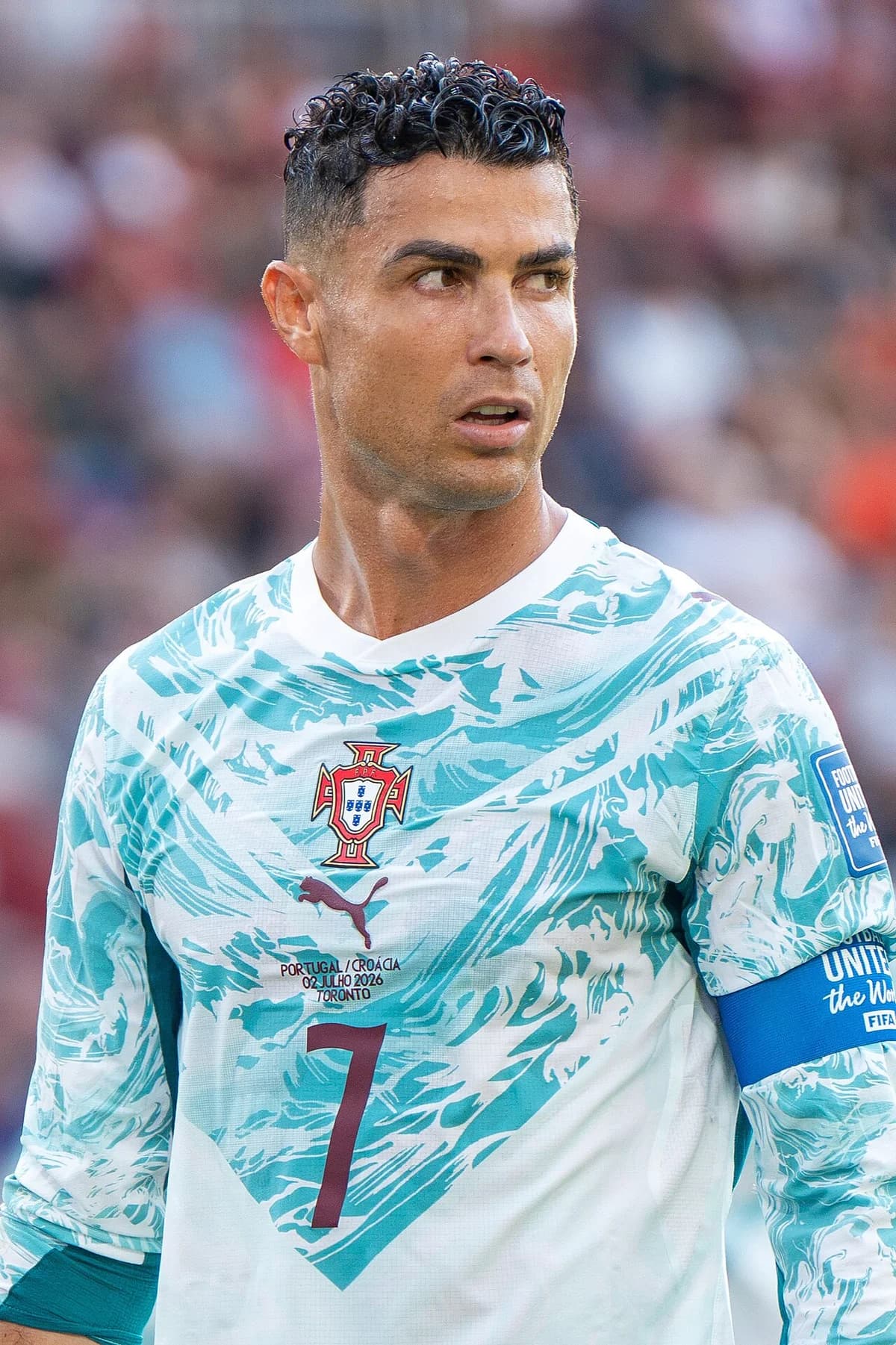 Close-up of Cristiano Ronaldo wearing Portugal’s jersey during a World Cup match.