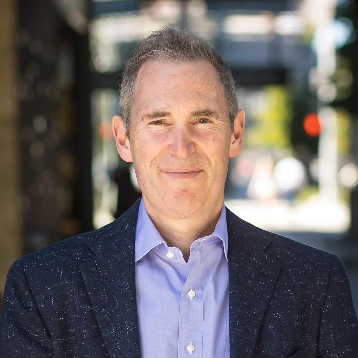 Headshot portrait of Andy Jassy in a suit jacket and dress shirt.