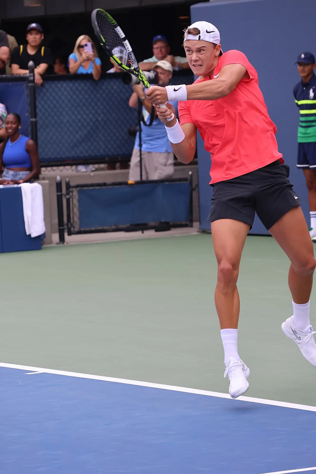 Holger Rune playing a tennis match on a hardcourt at the US Open.