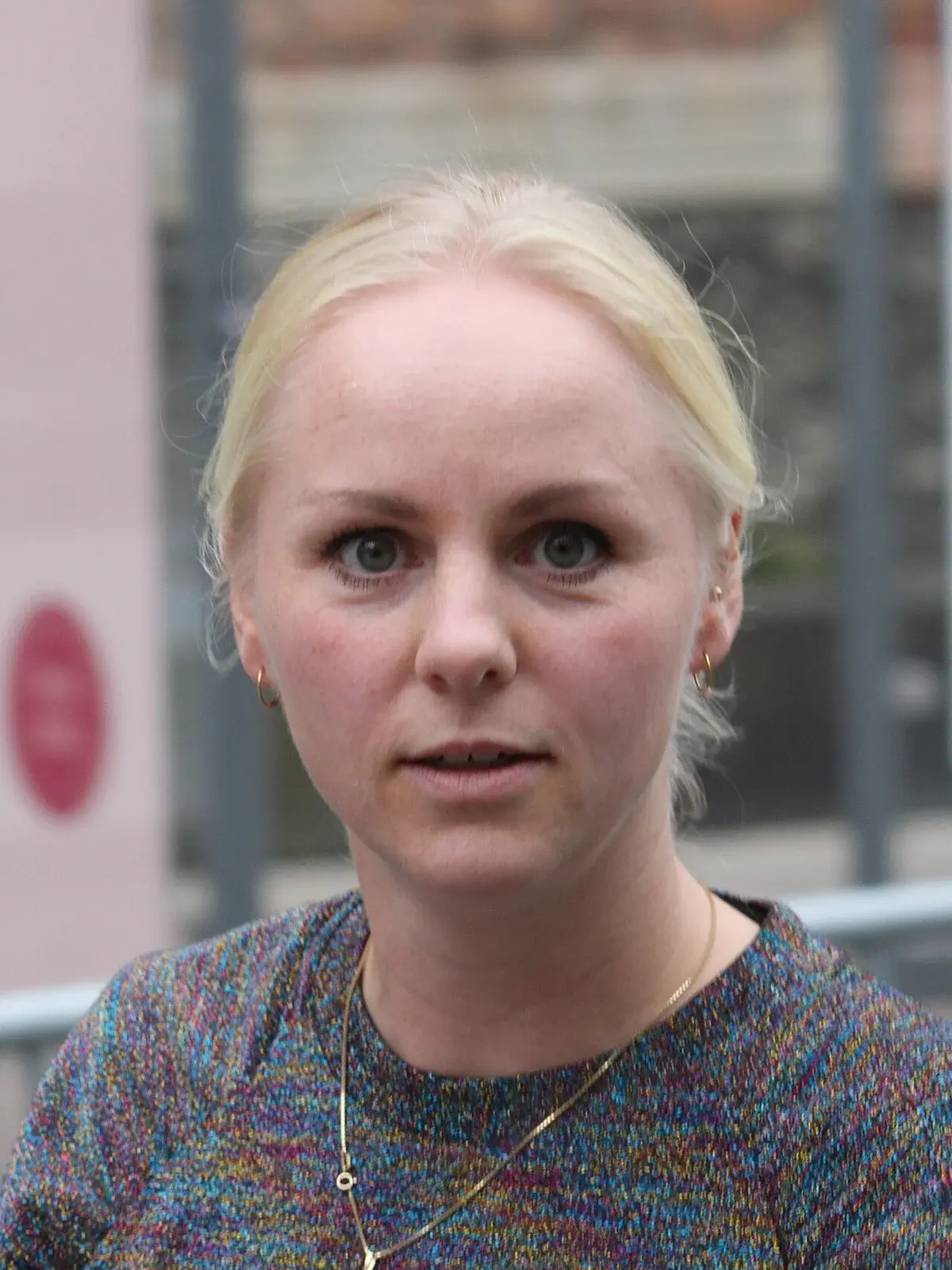 Close-up portrait of Signe Munk outdoors at Christiansborg.
