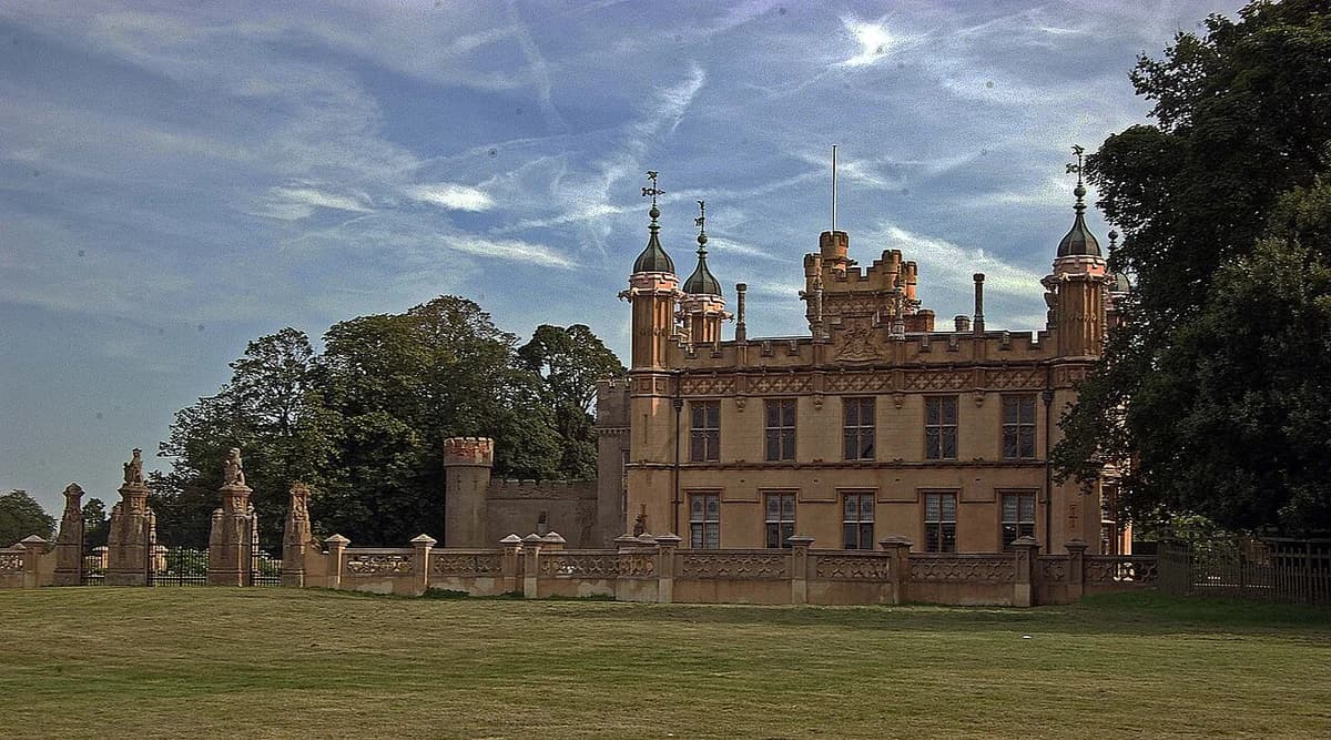 Knebworth House, a historic English manor with towers and turrets.