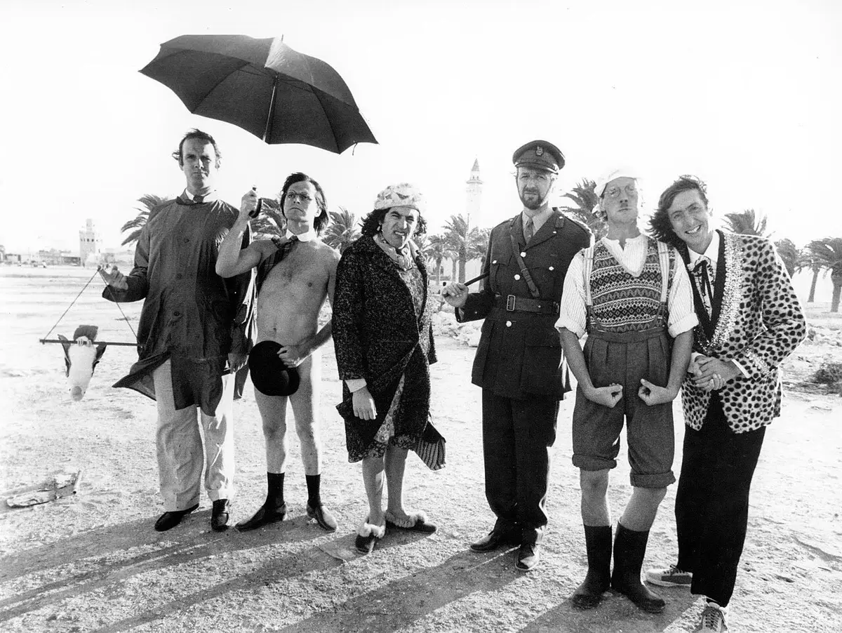 Black-and-white publicity photo of the six members of Monty Python standing outdoors in costume.