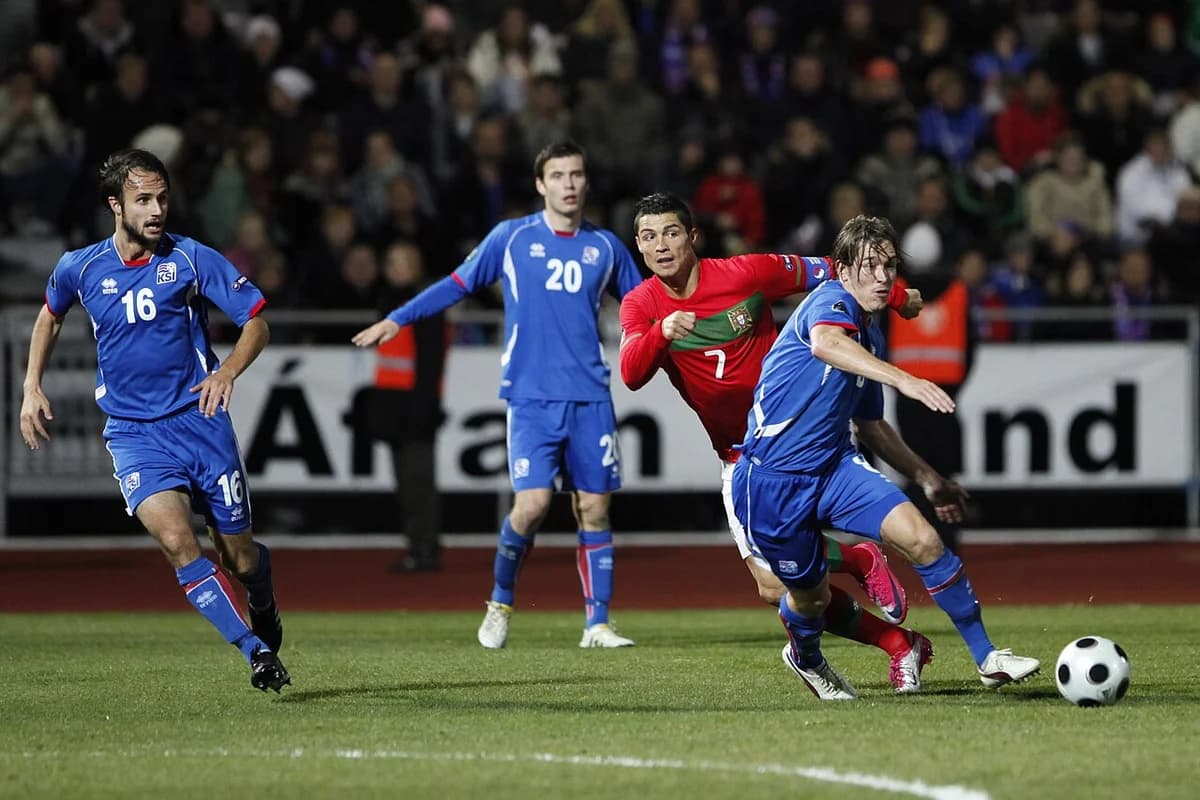 Cristiano Ronaldo playing in a football match against Iceland.