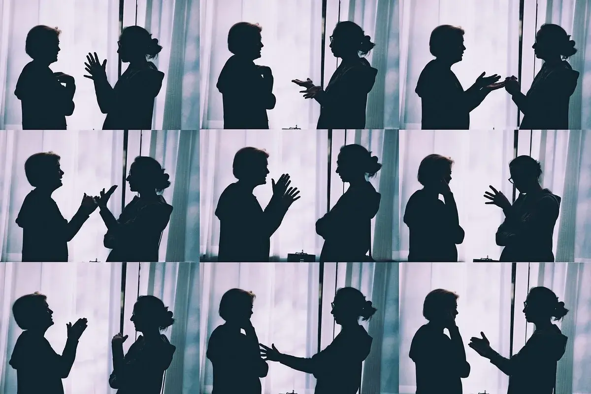 Silhouettes of two people talking and gesturing in a collage.