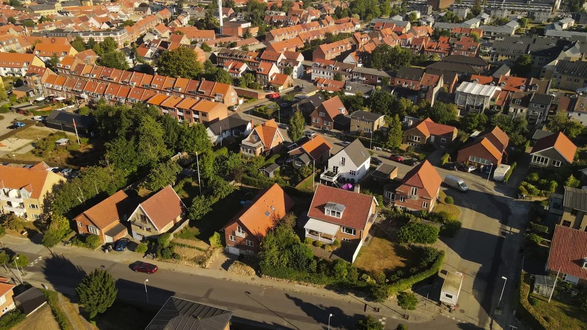 Aerial view of a residential neighborhood with red-roofed houses.