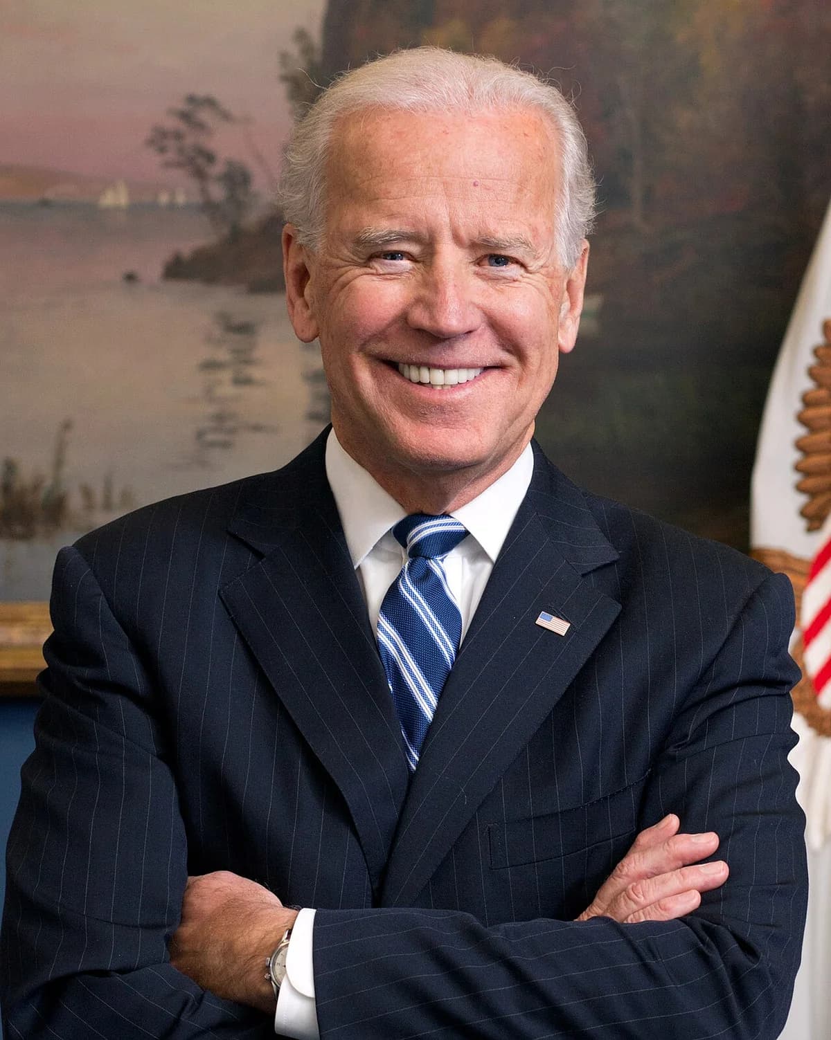 Portrait of Joe Biden in suit and tie with arms crossed