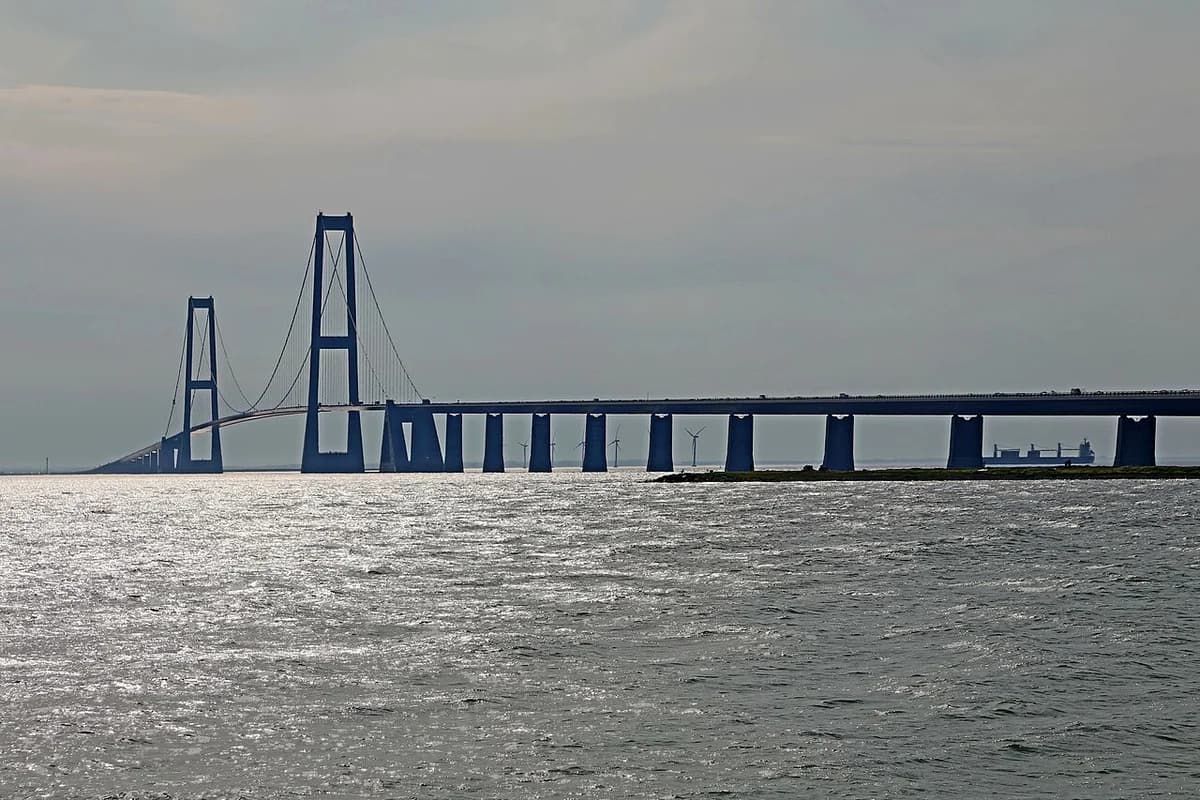 A long bridge crossing the water in Denmark.