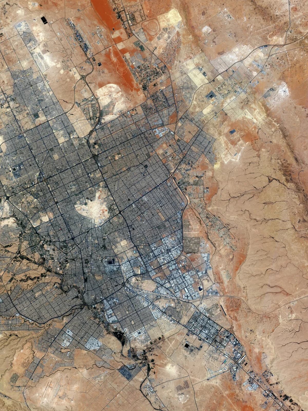 Satellite view of Riyadh city with grid streets and desert surroundings