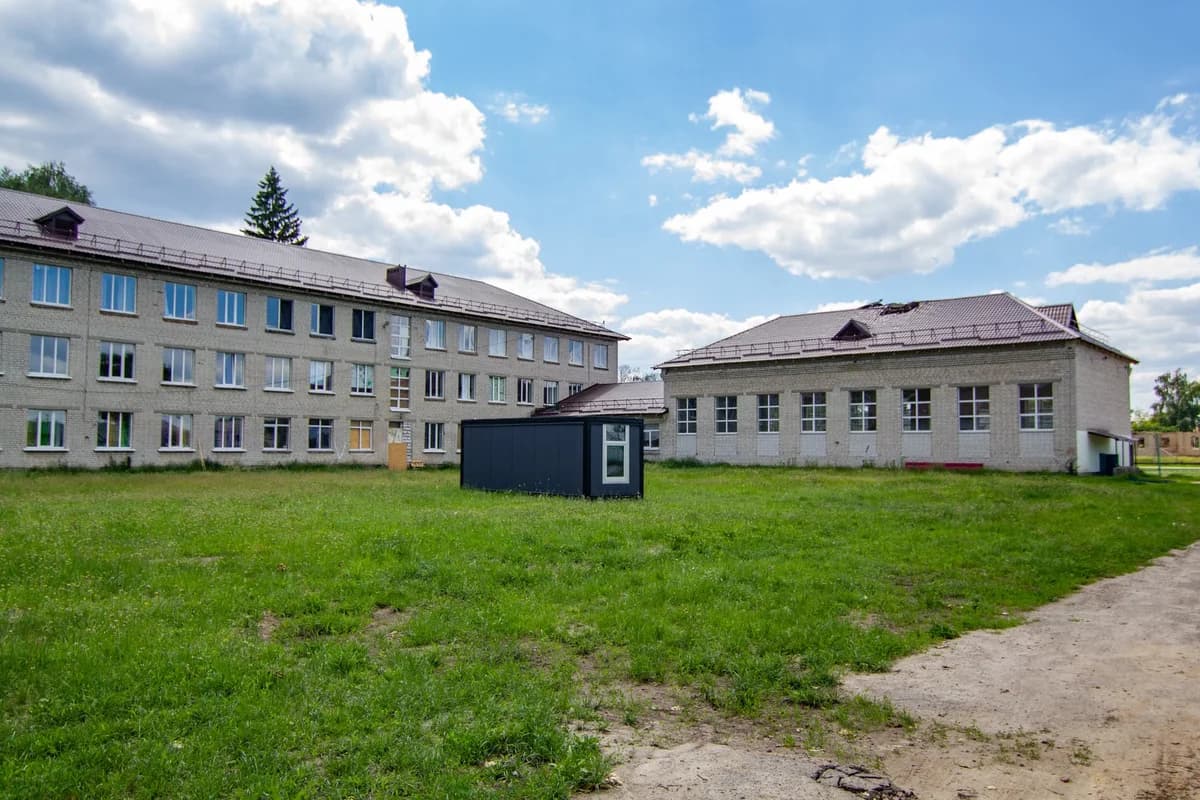 School buildings with open grassy courtyard