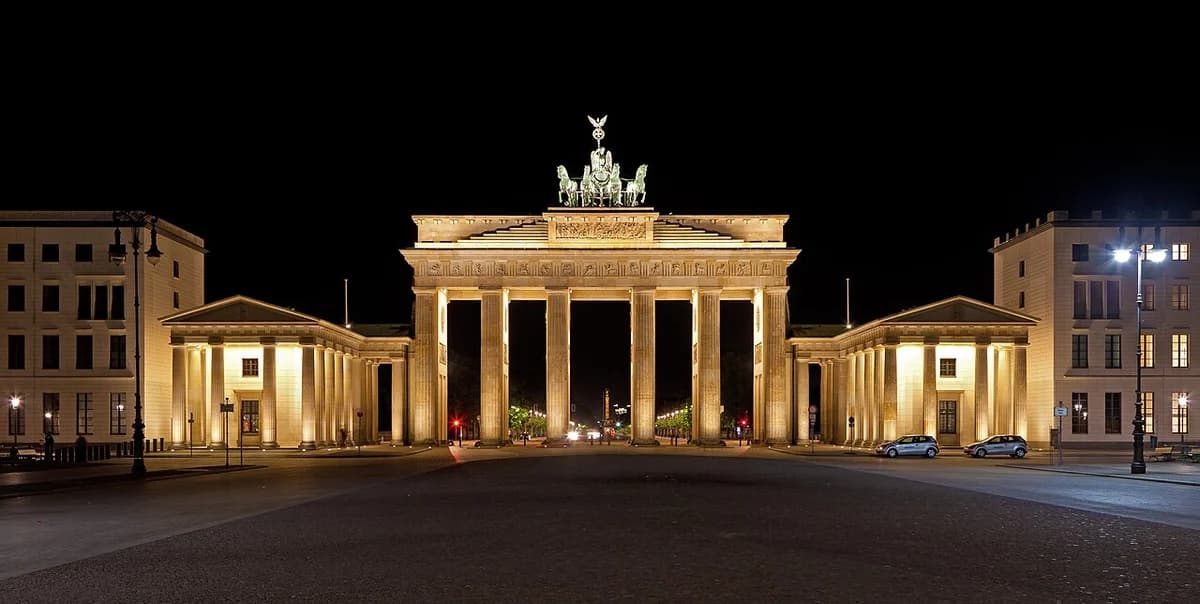 The Brandenburg Gate lit up at night in Berlin.