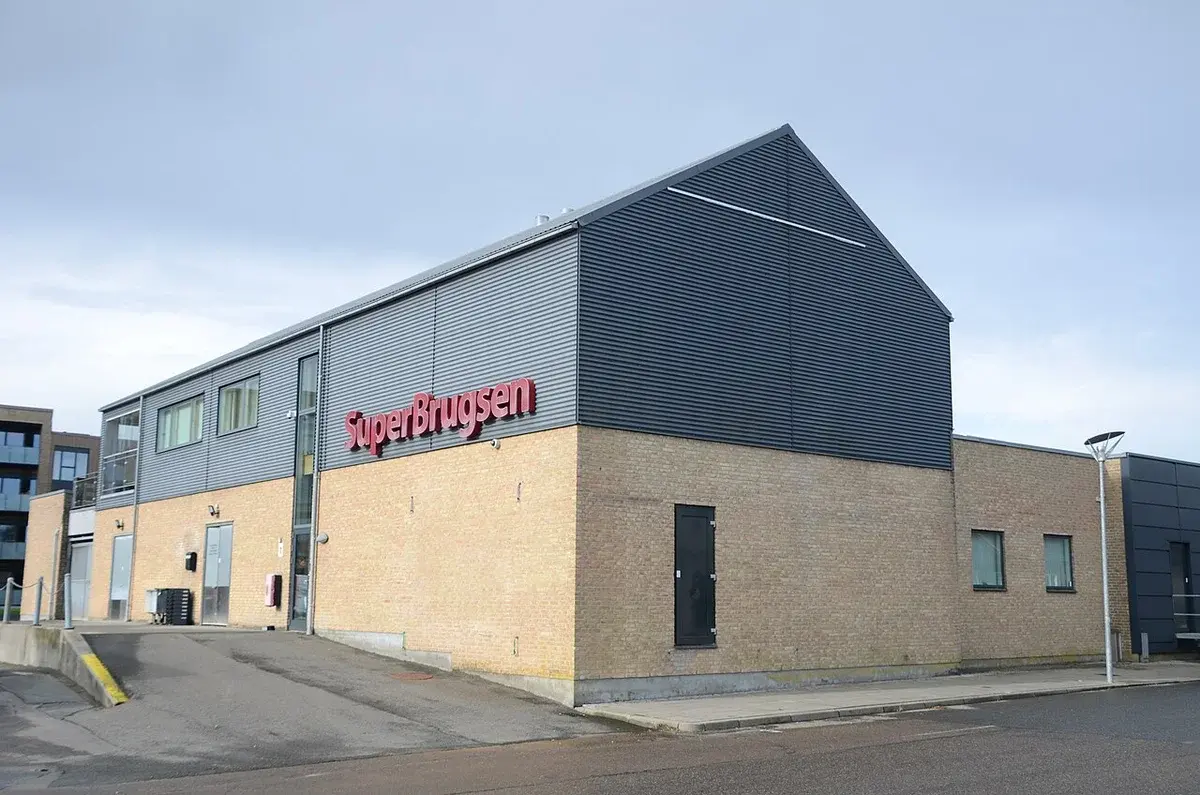 Exterior of a SuperBrugsen grocery store building.