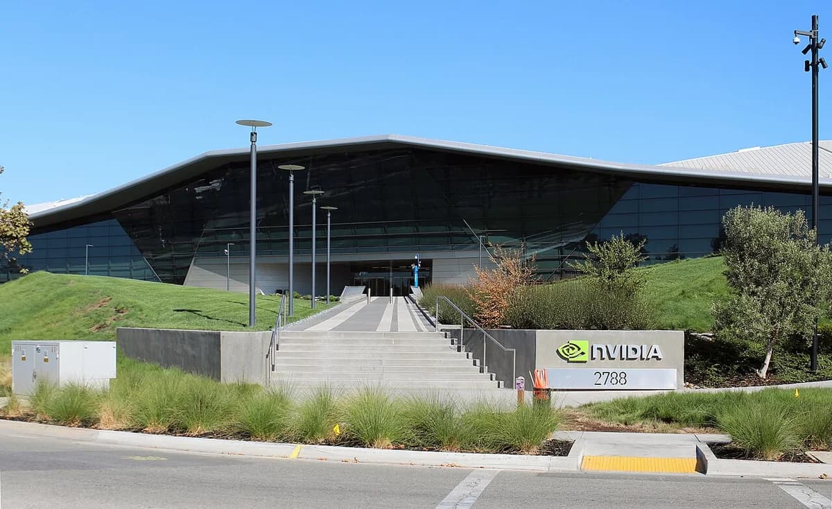 Exterior of NVIDIA headquarters building with a modern glass facade and main entrance.