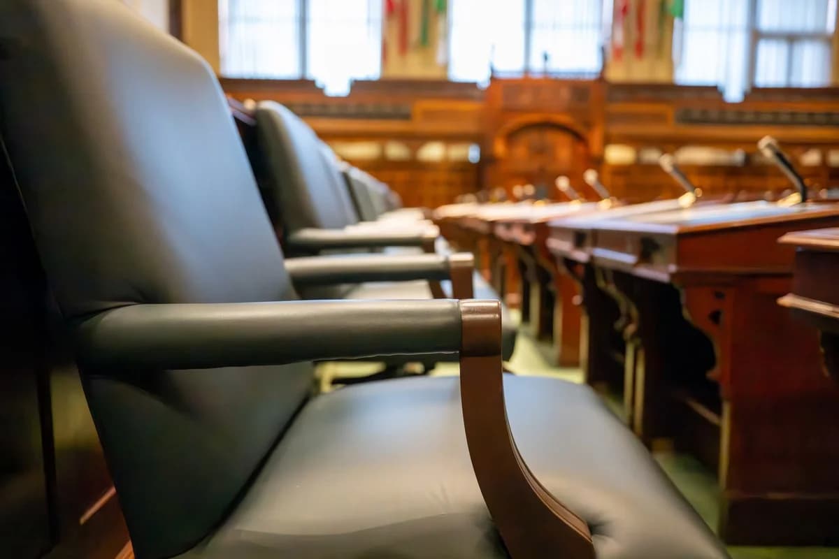 courtroom interior with leather chairs and wooden desks