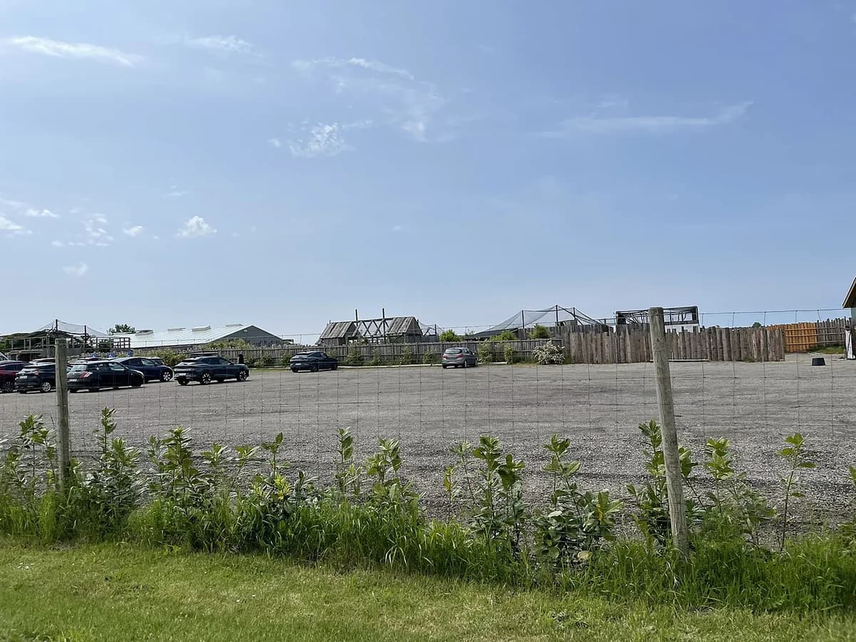 Outdoor view of the Crocodile Zoo on North Falster with parking and enclosures.