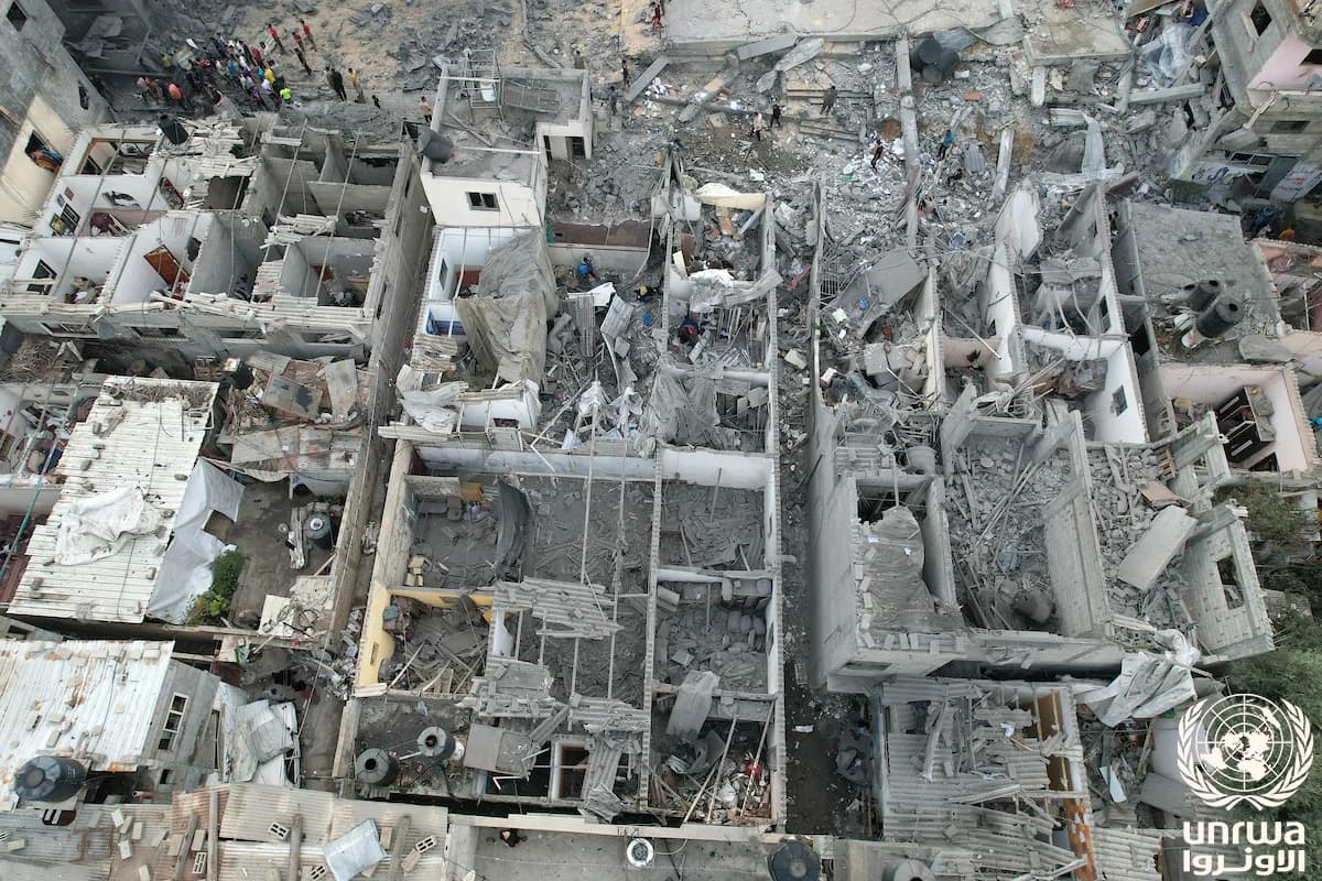 Aerial view of heavily damaged buildings and rubble in Gaza.