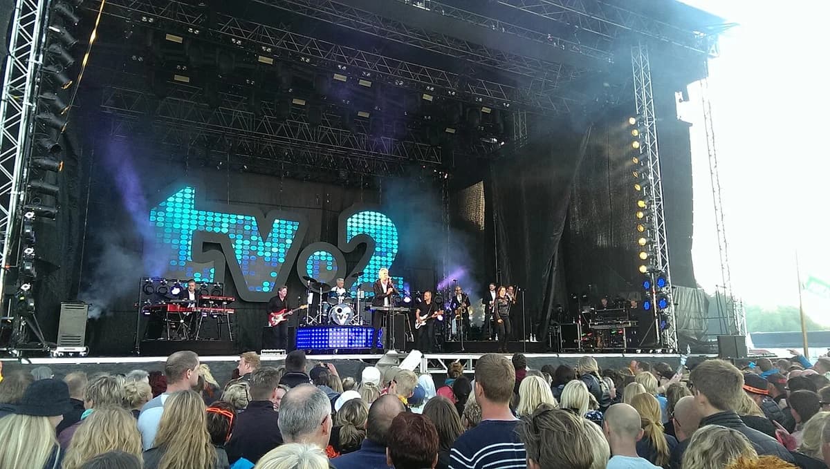 TV-2 performing live on stage in front of a large crowd in Skive