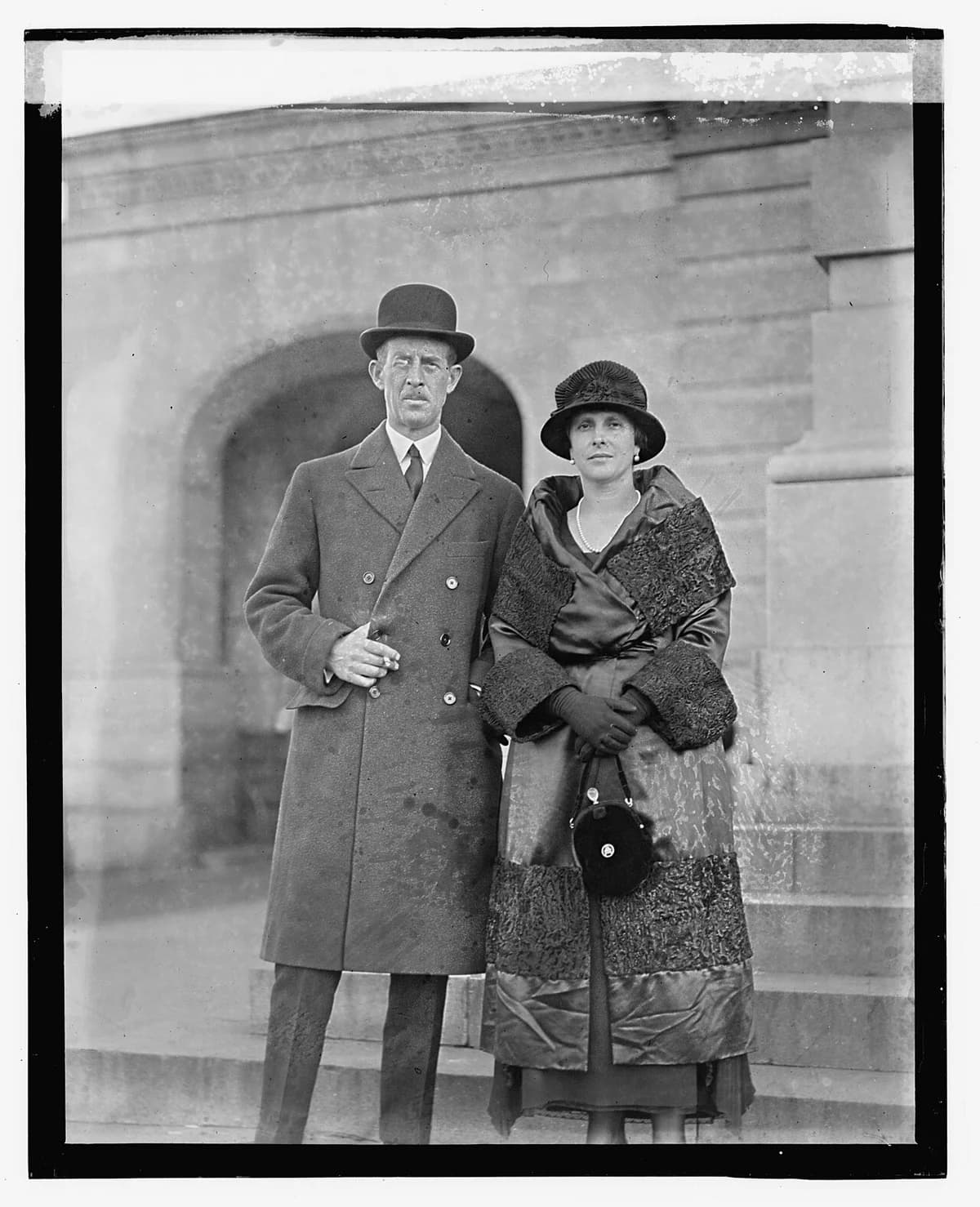 Prince Andrew standing with a woman in formal dress outdoors.