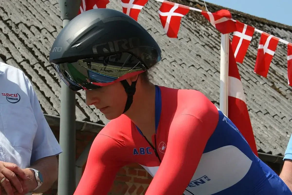 Cyclist in time trial gear with Danish flags
