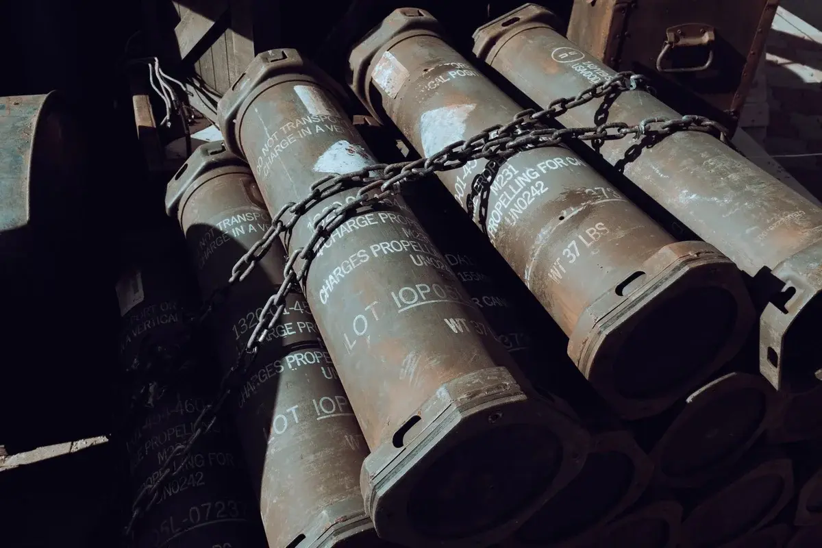 Chained military missile containers stacked in a warehouse