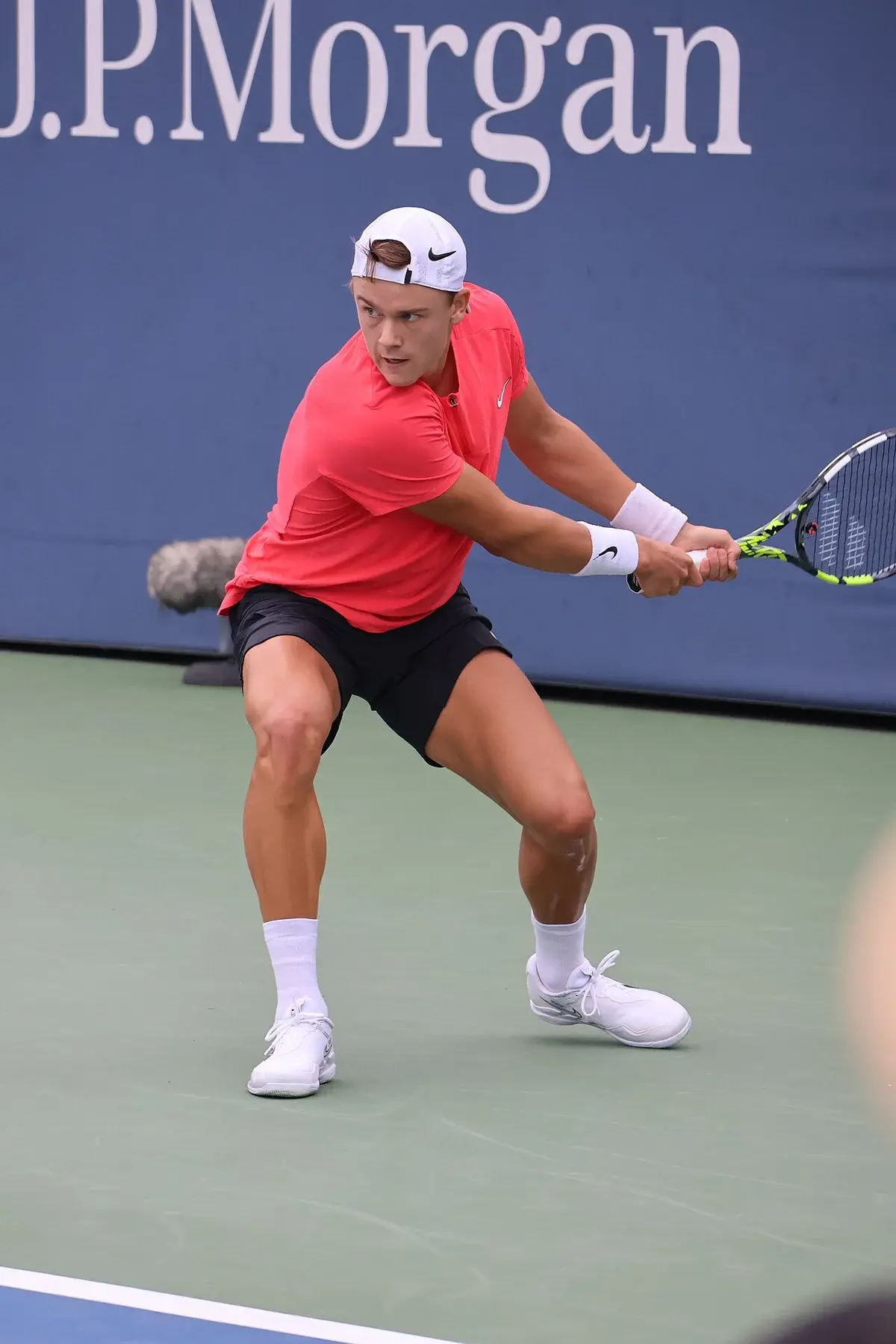 Holger Rune playing tennis during a US Open match.