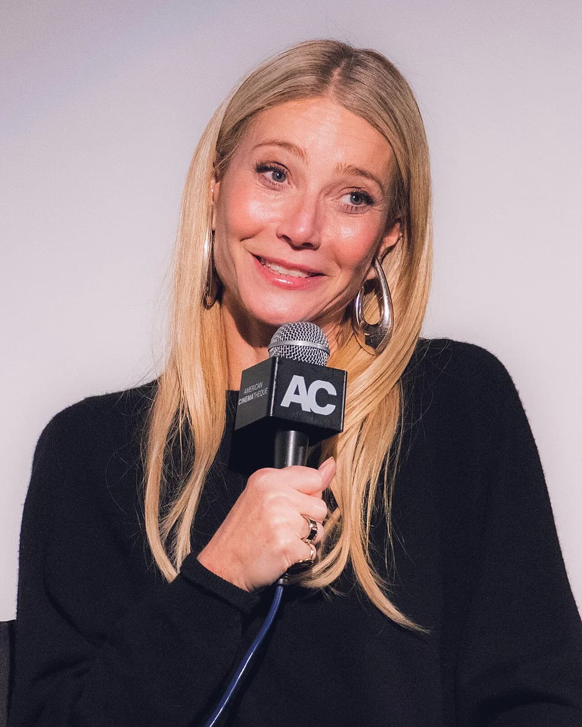 Gwyneth Paltrow speaking at a Q&A event.