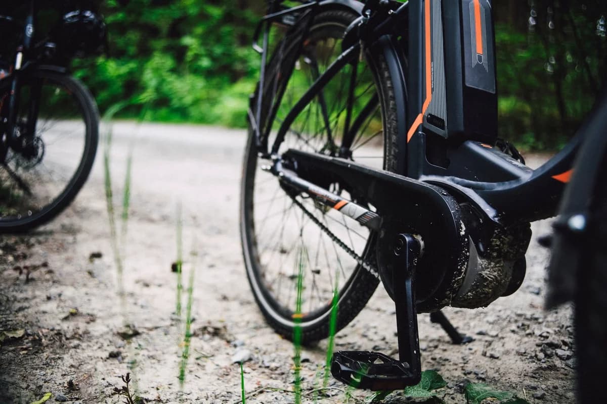 close-up of electric bike on forest dirt path