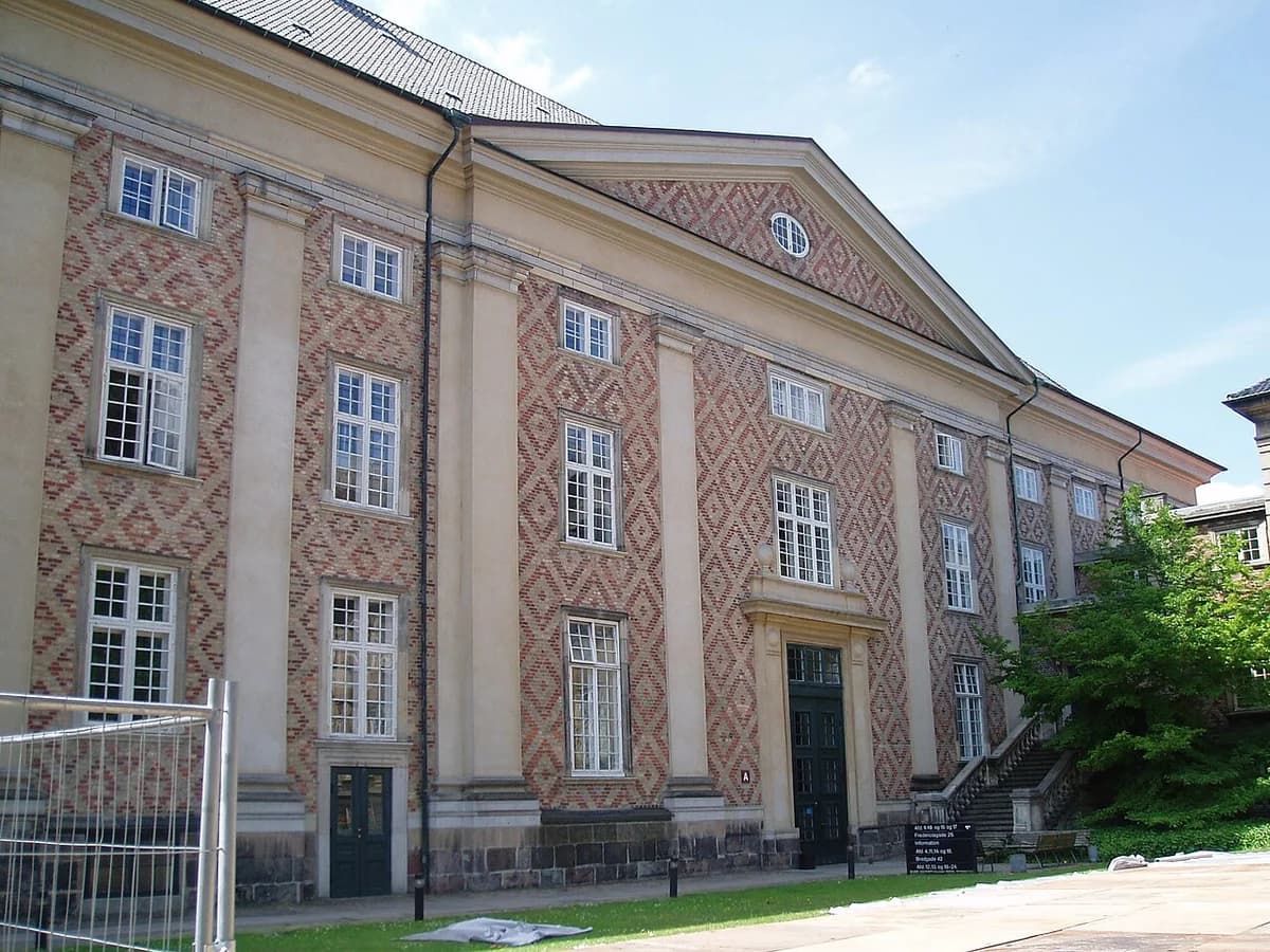 The northern facade of the Danish Eastern High Court building in Copenhagen, with patterned brick walls and tall windows.