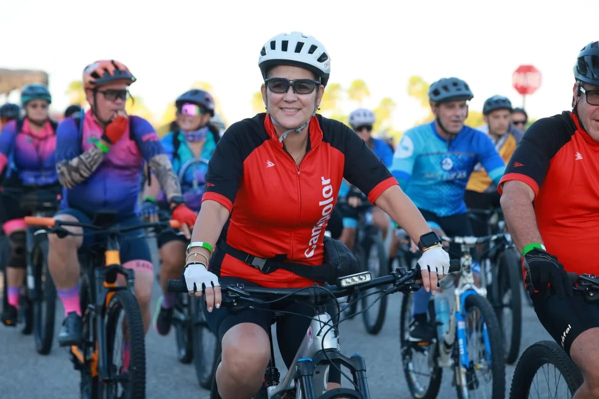 cyclists in colorful gear gathered outdoors on bikes