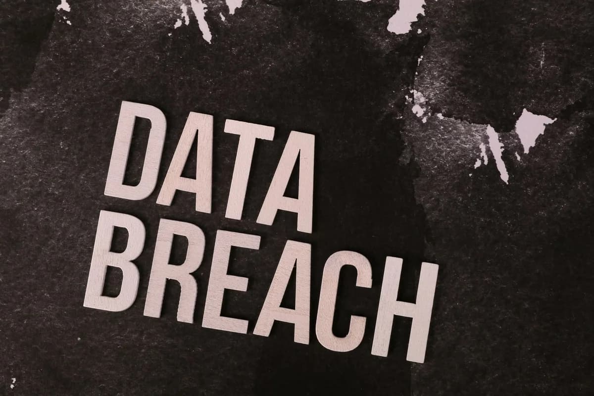 The words "DATA BREACH" on a dark textured background.
