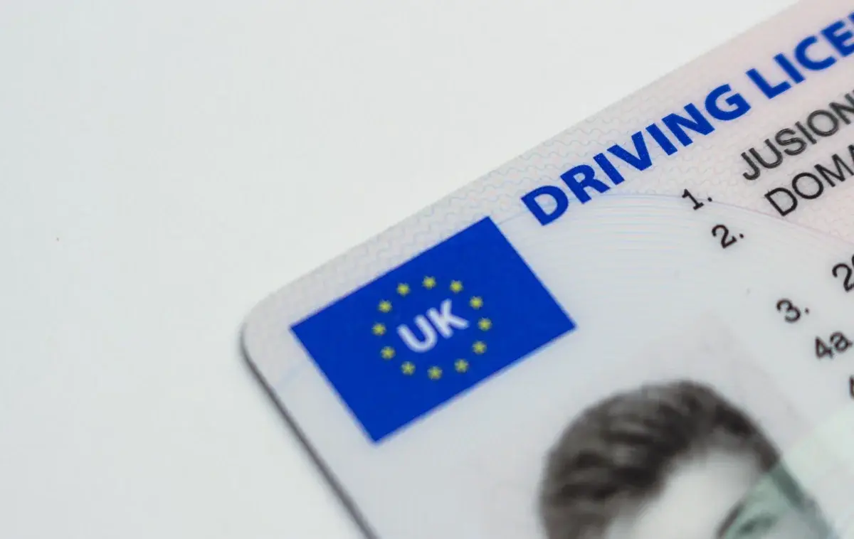 Close-up of a British driving licence with a UK/EU-style symbol.