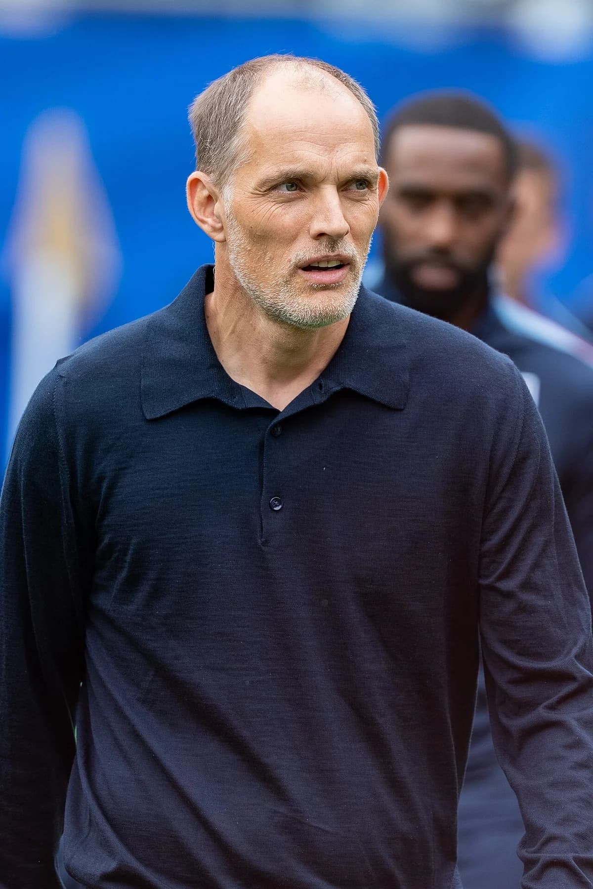 Thomas Tuchel standing on the sideline at a football match.