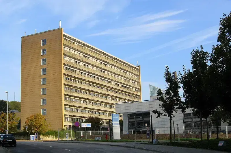 office buildings with trees and a clear sky