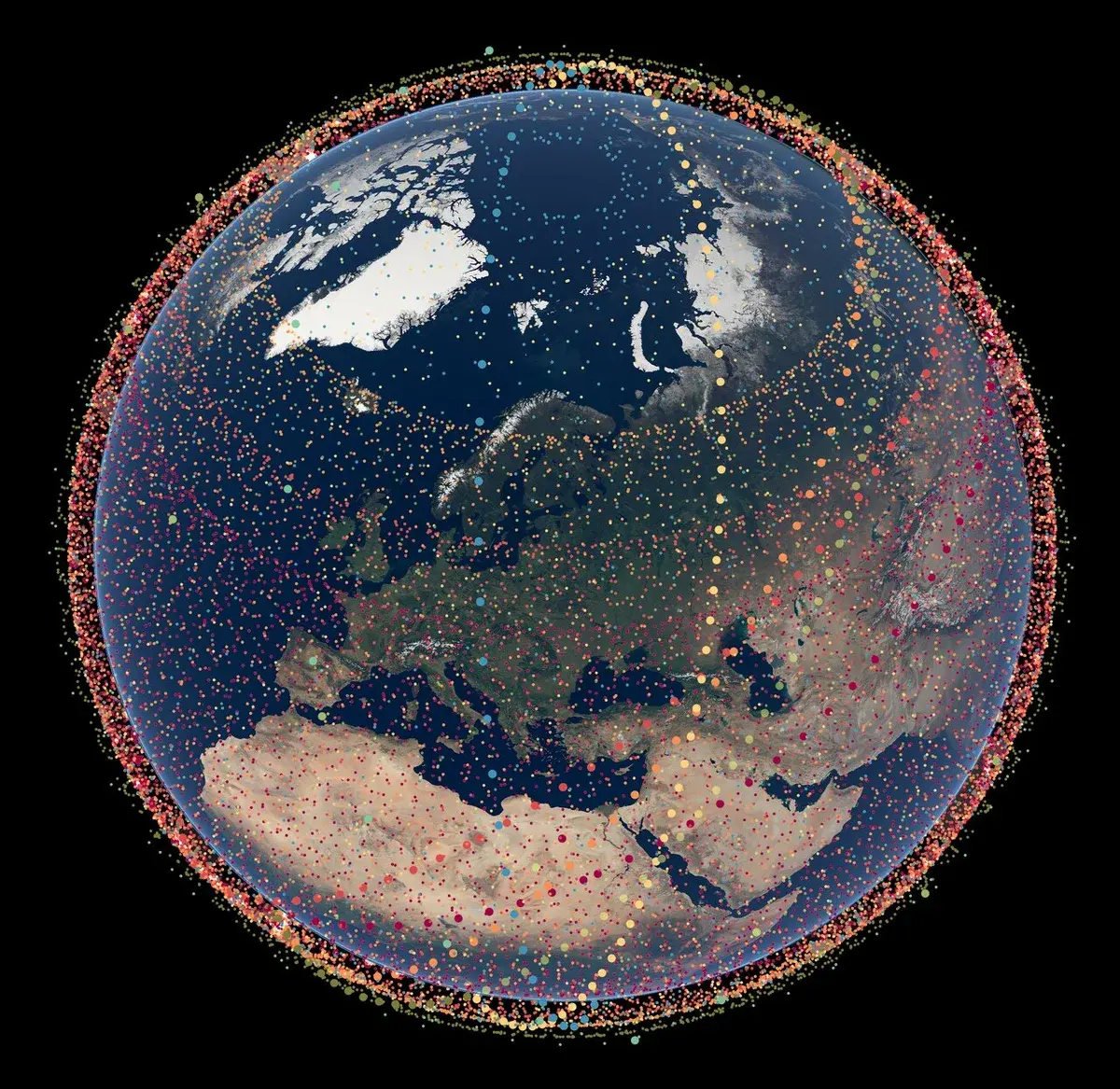 Earth surrounded by thousands of colored dots representing Starlink satellites.