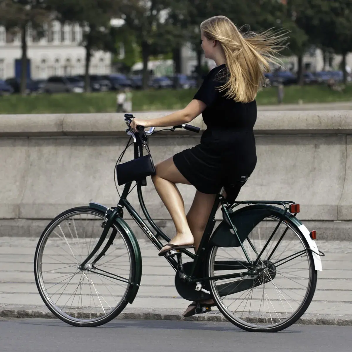 A woman riding a bicycle in Copenhagen
