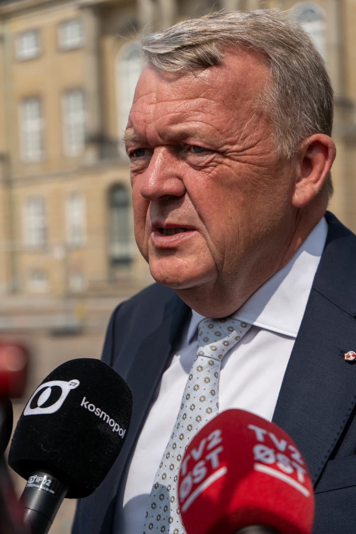 Lars Løkke Rasmussen speaking to reporters outside at Amalienborg Slotsplads in Copenhagen.