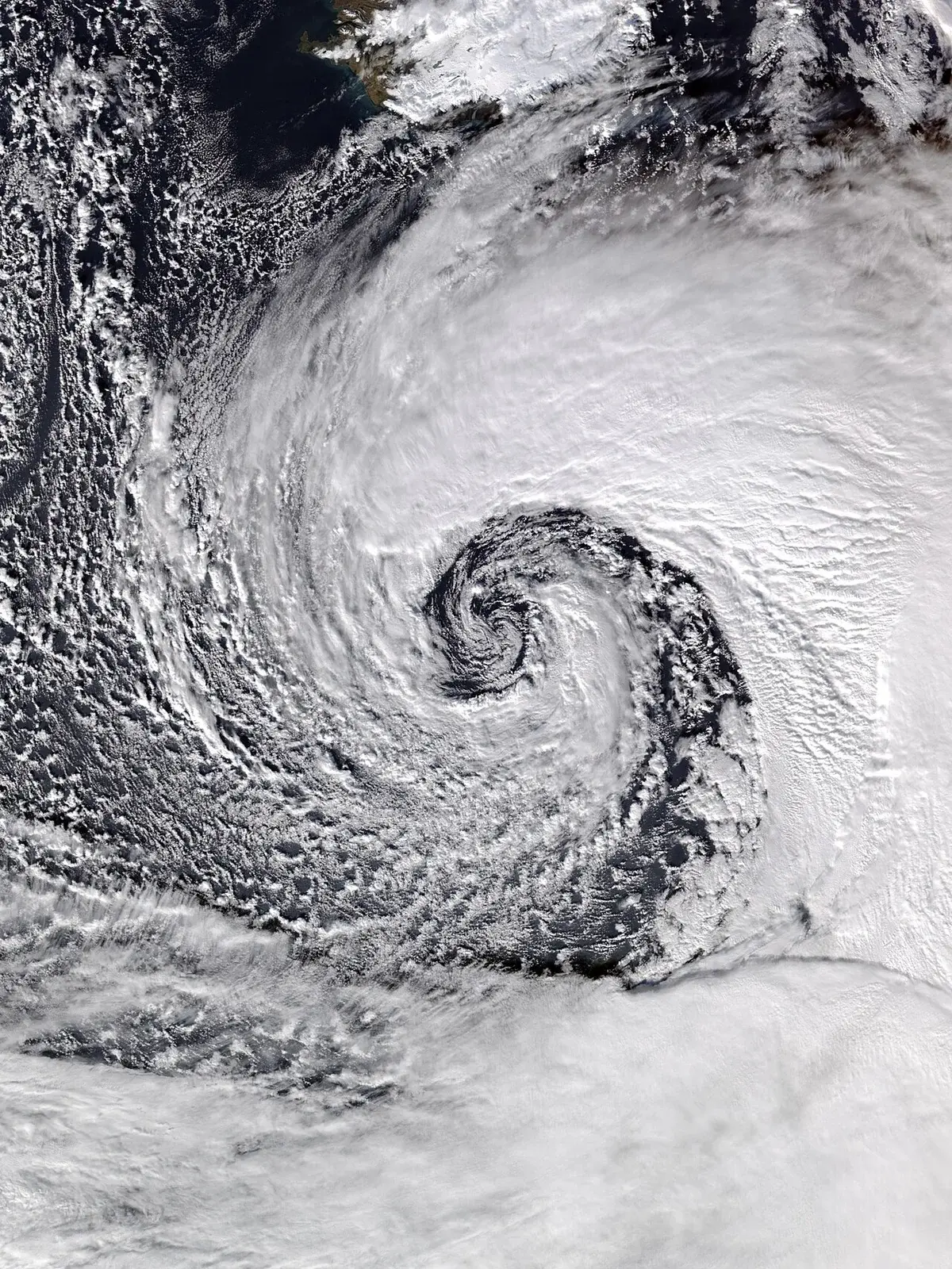 Satellite view of a large swirling storm near the British Isles.