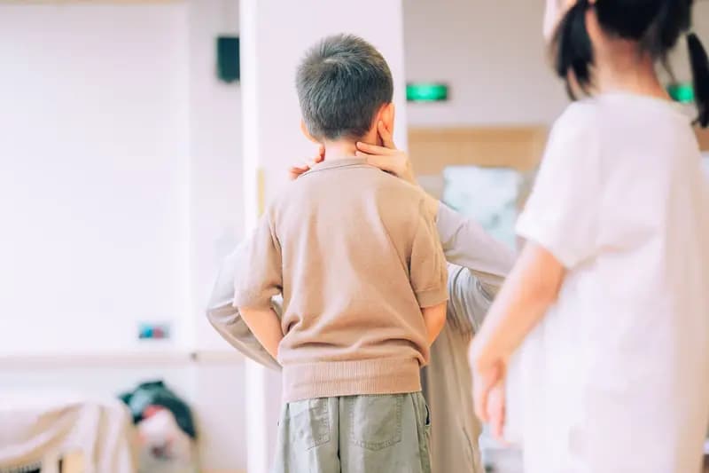 adult talking to children indoors