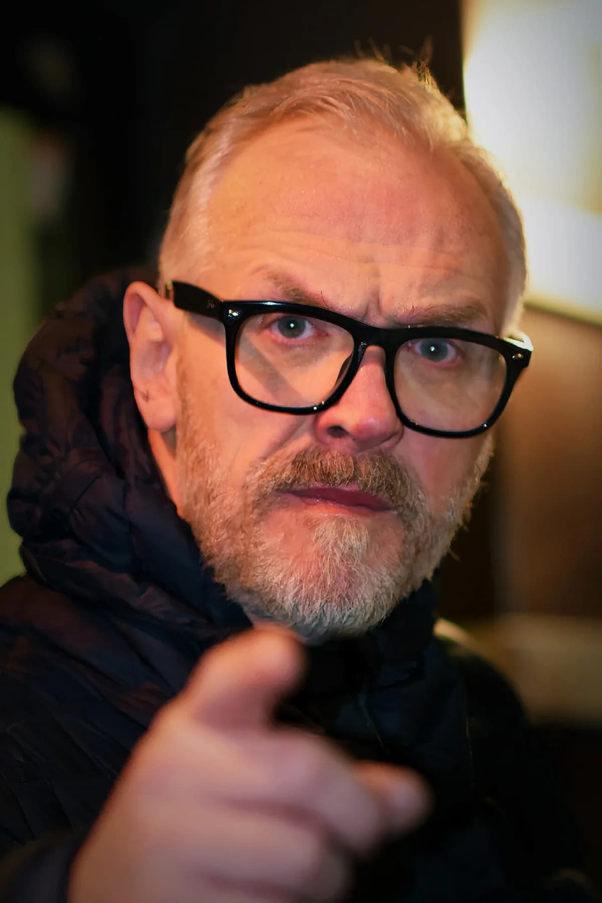 Close-up of Greg Davies pointing at the camera.