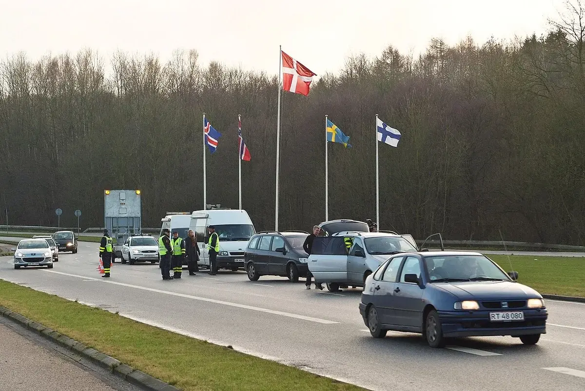 Border police checking cars at the Danish-German border crossing.