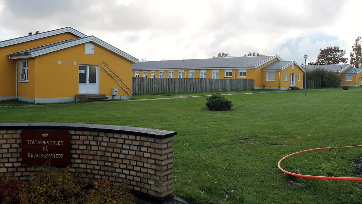 Yellow buildings of the State Prison at Kragskovhede with a green lawn