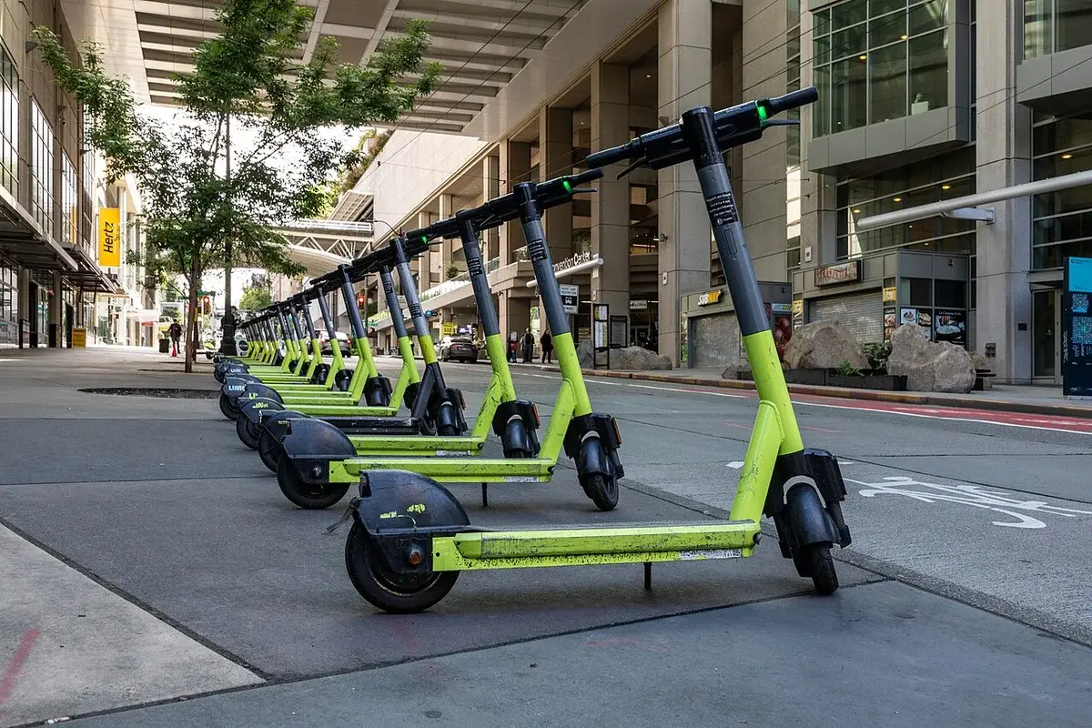 Row of Link electric scooters parked on a Seattle sidewalk