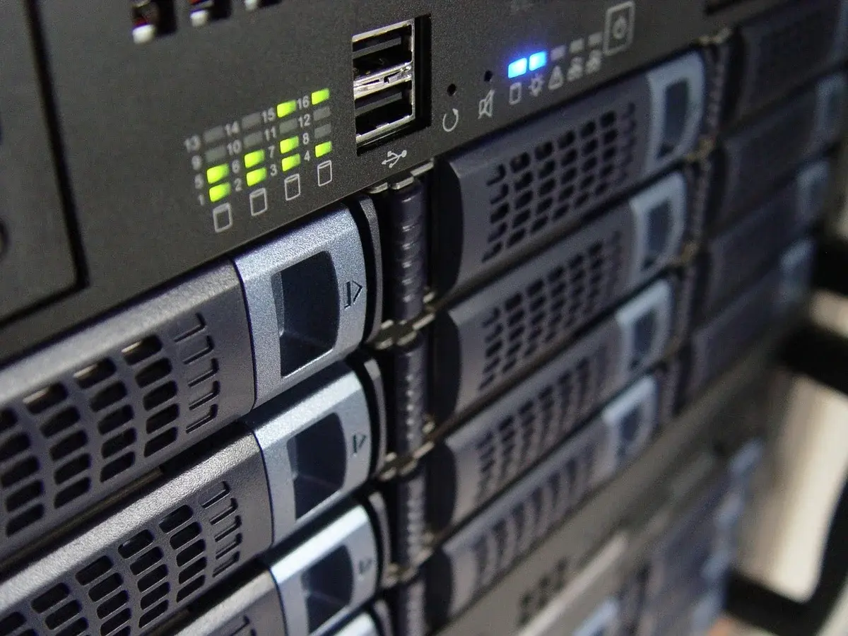 Close-up of stacked server hardware with indicator lights.