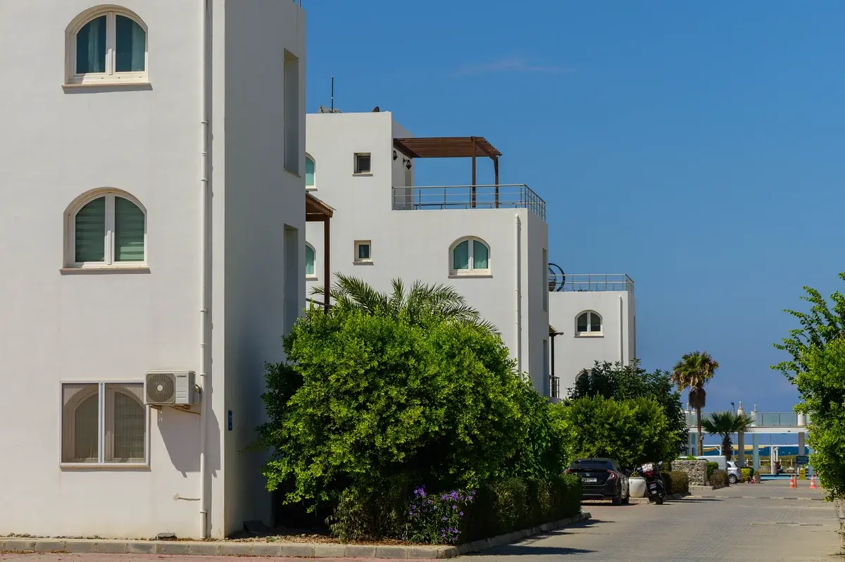 White villas in a coastal residential complex on Cyprus.