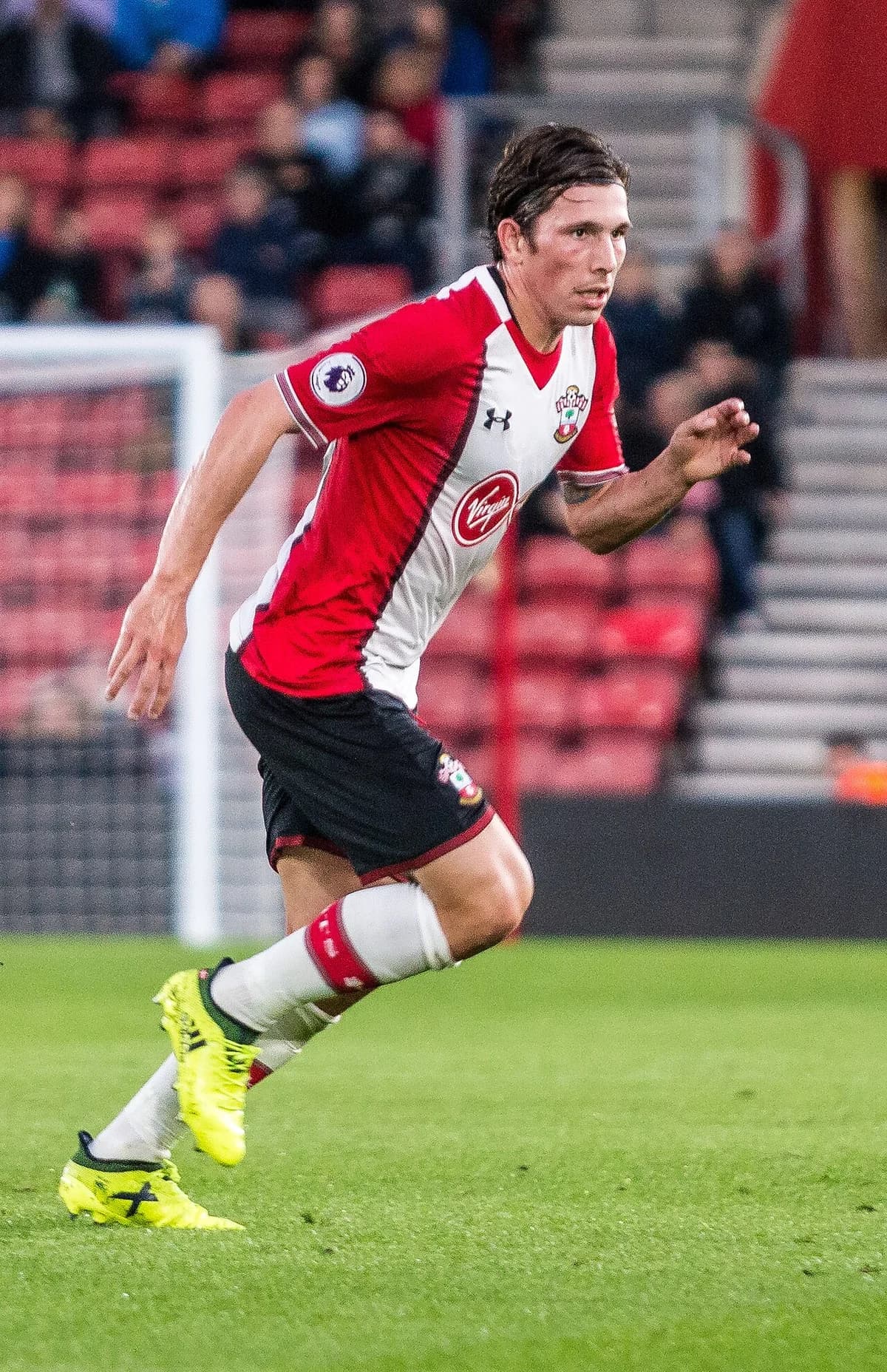 A Southampton FC player running during a football match.