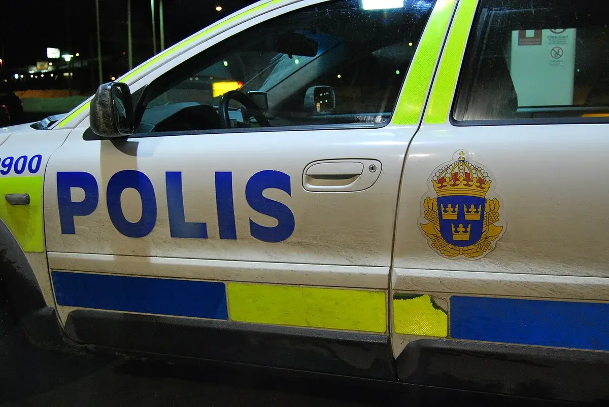 Close-up of a parked Swedish police car with POLIS lettering and the police emblem.