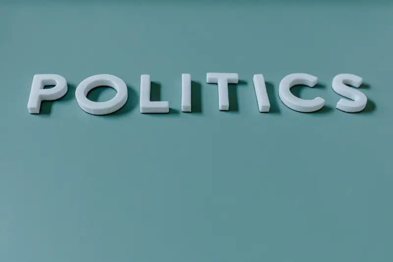 Word 'POLITICS' in white letters on teal background