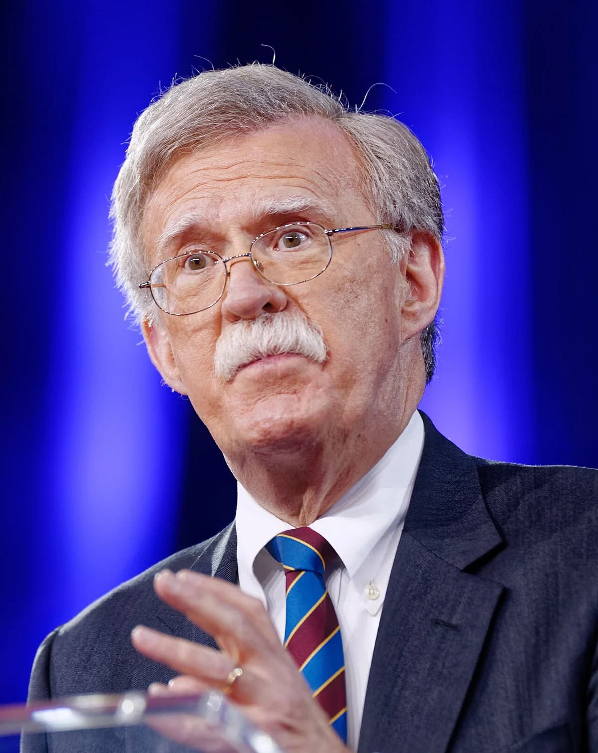 John R. Bolton speaking on stage at CPAC.