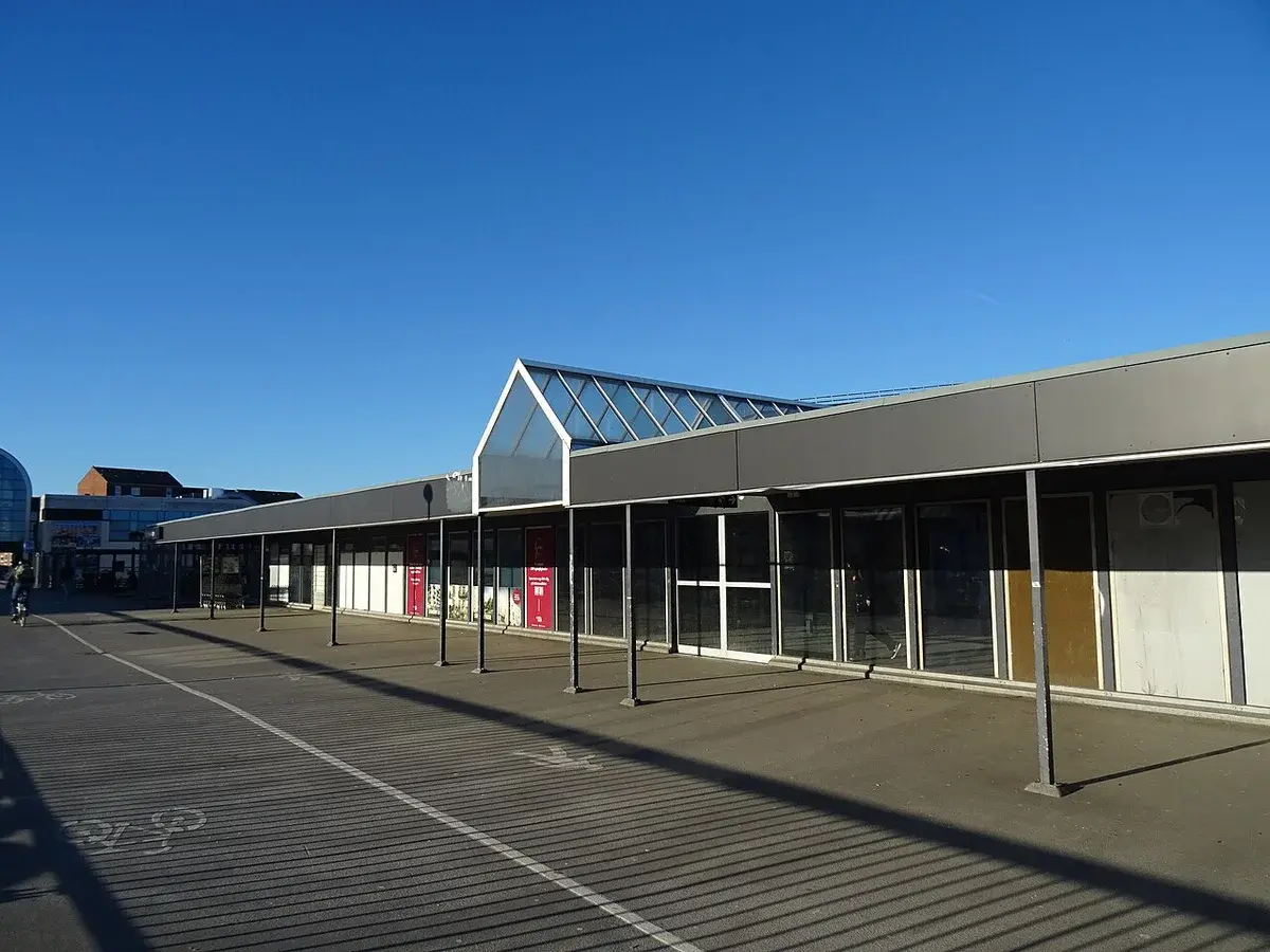 Modern train station platform and building in Denmark.